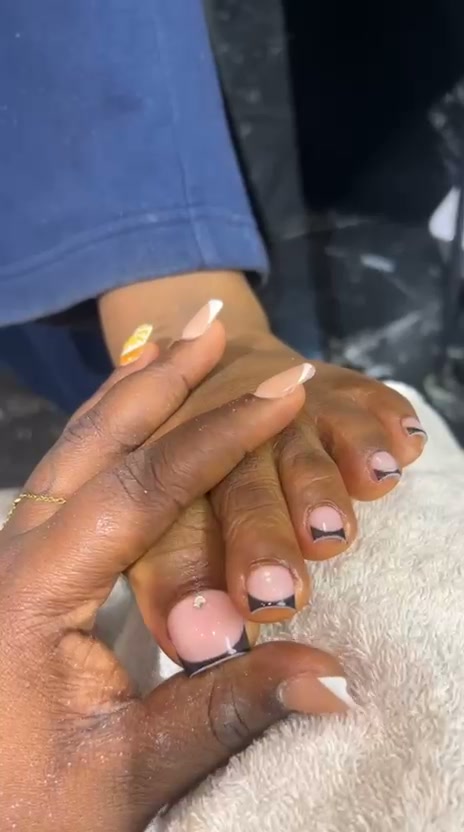 Nude nails with black French tips